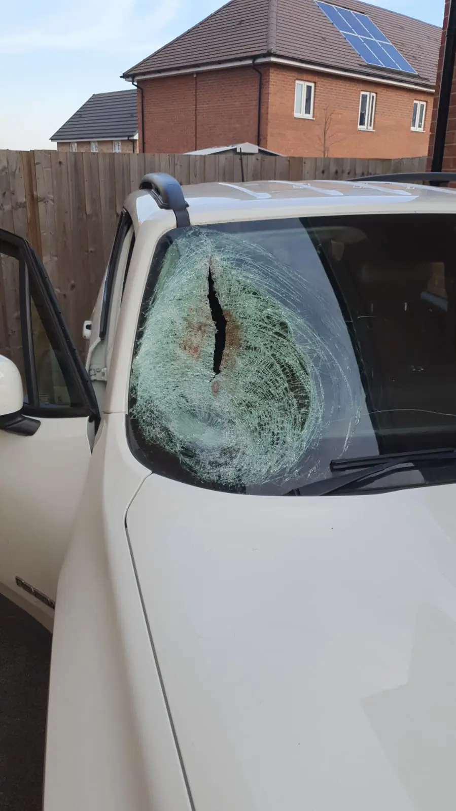 Cracked windshield on black car