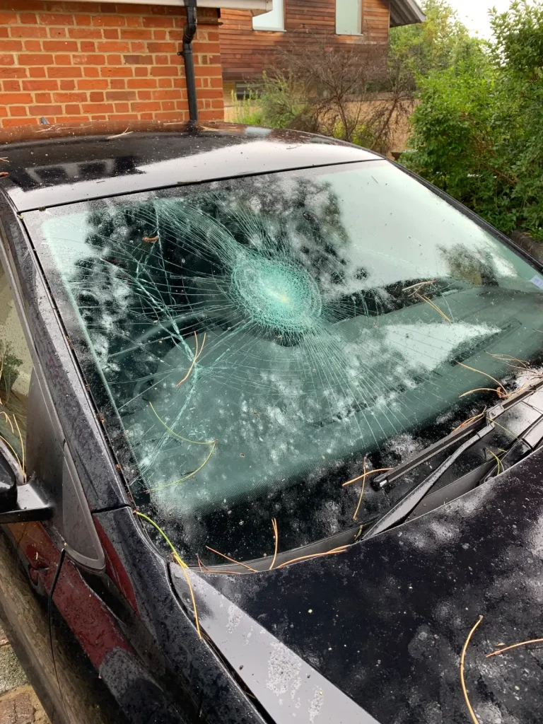 Cracked windshield on black car