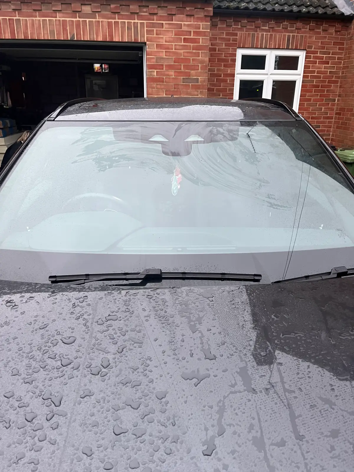 Wet car windshield close-up